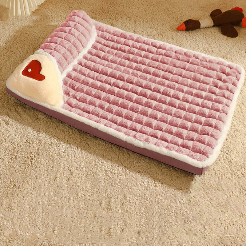 Cozy pink pet bed with heart design, featuring a removable and washable cover for year-round comfort and hygiene.