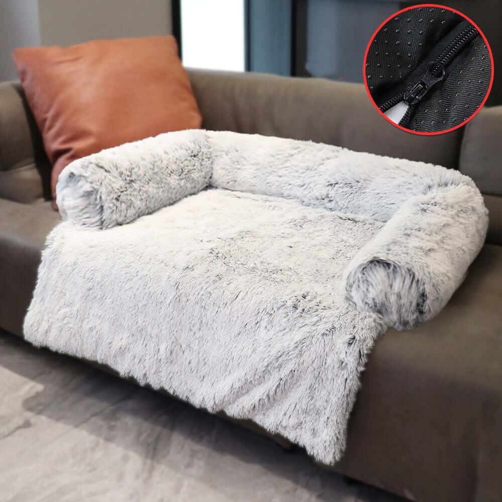 Plush removable dog bed on sofa with washable cover, offering comfort and warmth for pets during winter.