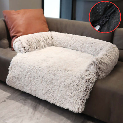 Cozy removable plush dog bed on sofa, offering warmth and comfort. Perfect winter retreat for pets with washable cover.