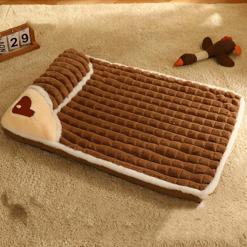 Cozy brown pet bed with a heart design, providing comfort and relaxation for pets all year round, shown on a beige carpet.